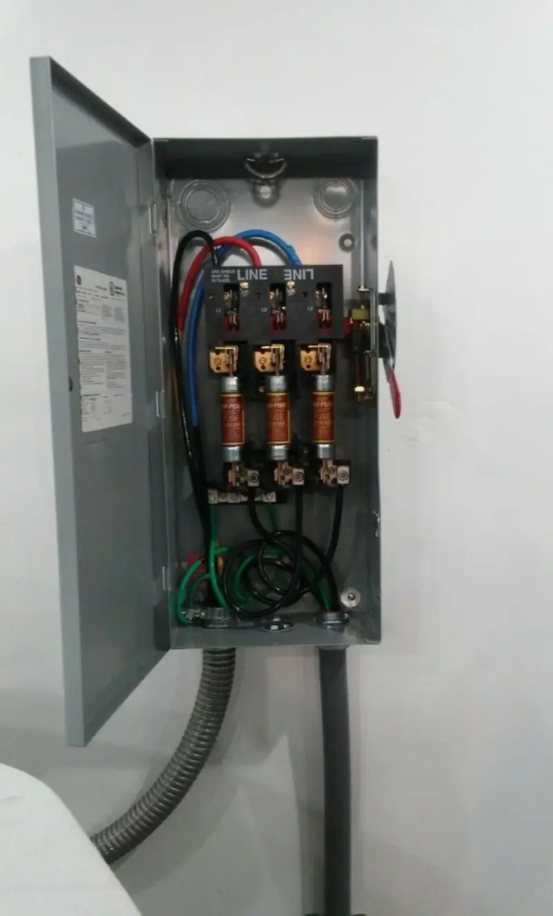 Three-phase disconnect switch installed for Smoke Detector Installation in DeKalb